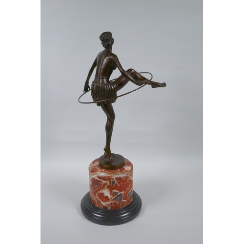 226 - After Dominque  Alonzo, Art Deco style bronze of a dancing girl with a hula hoop, on a marble s... 