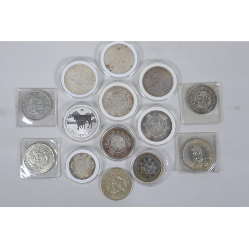 229 - A quantity of Chinese facsimile (replica) white metal coinage, many coins in collector's cases