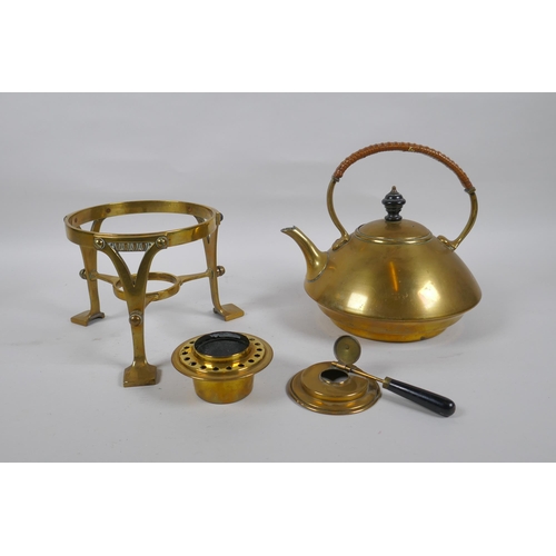 23 - An Arts and Crafts brass spirit kettle, 29cm high