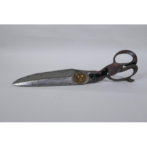 24 - A pair of US made tailor's shears by R. Heinisch of Newark, New Jersey, in steel with brass cap, 38c... 