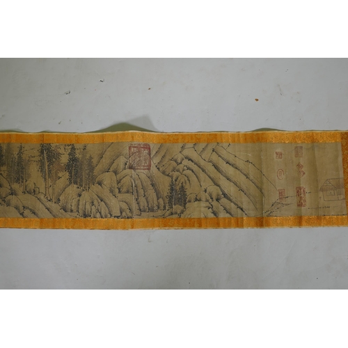 246 - A Chinese watercolour scroll depicting an extensive cliffside landscape, 23cm high