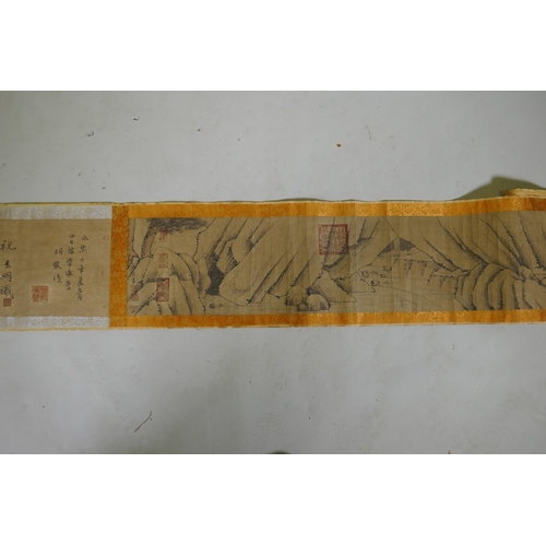 246 - A Chinese watercolour scroll depicting an extensive cliffside landscape, 23cm high