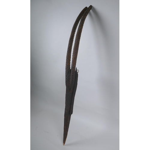 247 - An African carved Chiwara (antelope) mask, probably from Mali, 77cm high