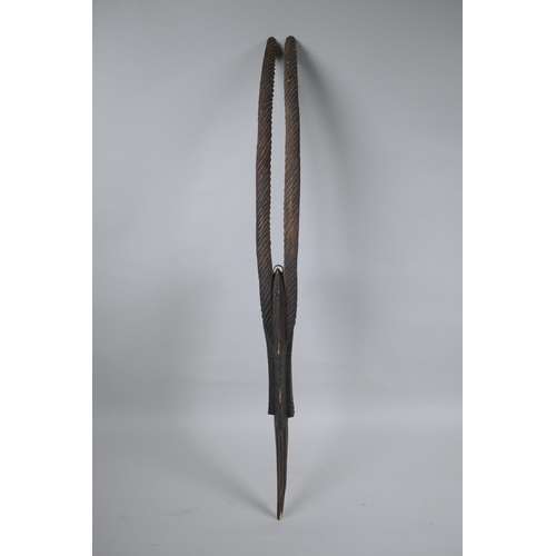 247 - An African carved Chiwara (antelope) mask, probably from Mali, 77cm high