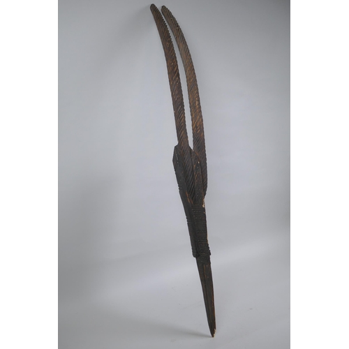 247 - An African carved Chiwara (antelope) mask, probably from Mali, 77cm high