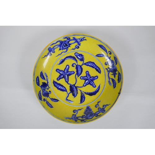 251 - A Chinese imperial yellow ground porcelain dish with blue and white floral decoration, Zhengde 4 cha... 