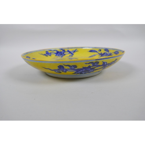 251 - A Chinese imperial yellow ground porcelain dish with blue and white floral decoration, Zhengde 4 cha... 