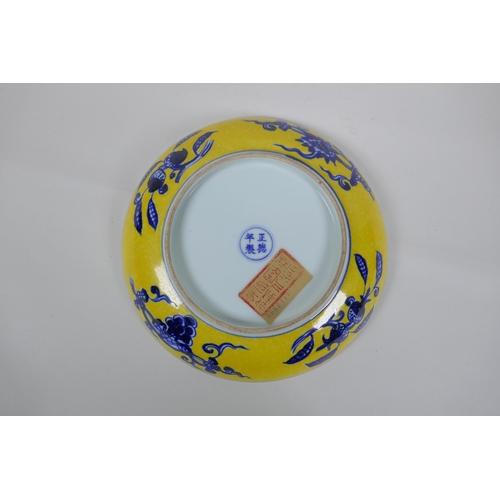 251 - A Chinese imperial yellow ground porcelain dish with blue and white floral decoration, Zhengde 4 cha... 