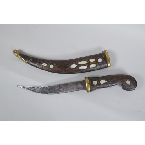 252 - A Turkish dagger Jambiya, with mother of pearl inlaid wood handle and sheath, and brass mounts, toge... 