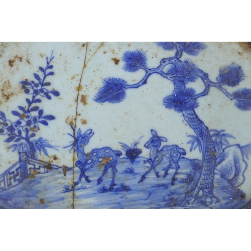 253 - A late C19th/early C20th Chinese export blue and white porcelain dish, decorated with deer in a gard... 