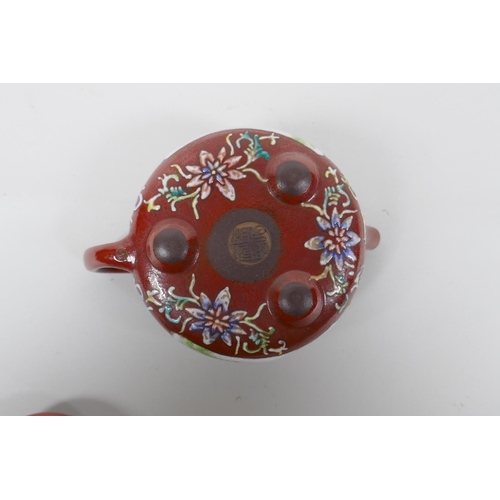 254 - A Chinese YiXing teapot of squat form with polychrome enamel decoration, impressed mark to base, 10c... 