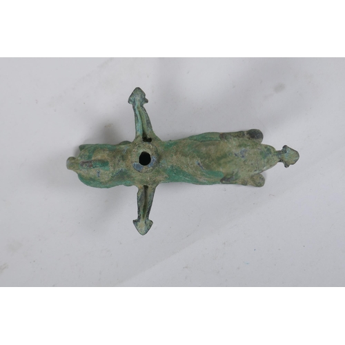 255 - A Persian cast metal oil lamp in the form of a lion, 15cm long