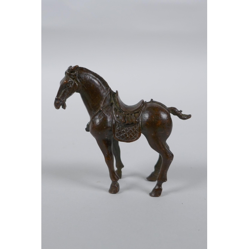 256 - A Chinese bronze figure of a Tang style horse, 7cm high