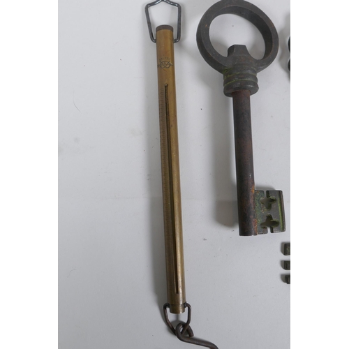 259 - Two antique Salter brass spring balance scales, and two cast iron oversized keys, largest 35cm