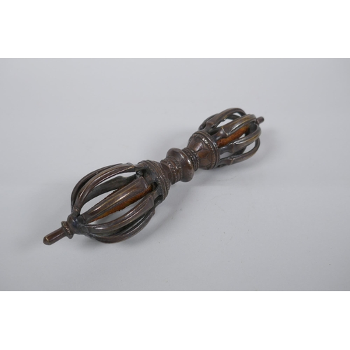 260 - A Tibetan bronzed metal vajra, 20cm long