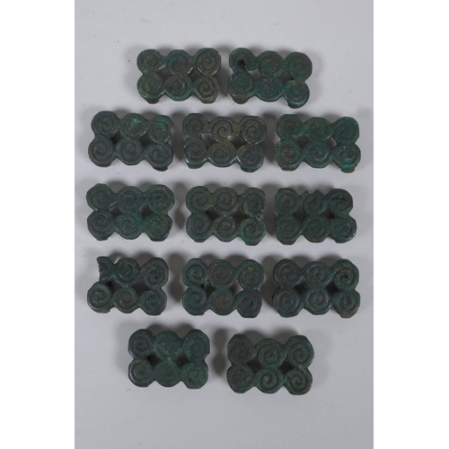 266 - A quantity of bronze belt buckles with a green patina and spiral decoration, 4 x 3cm