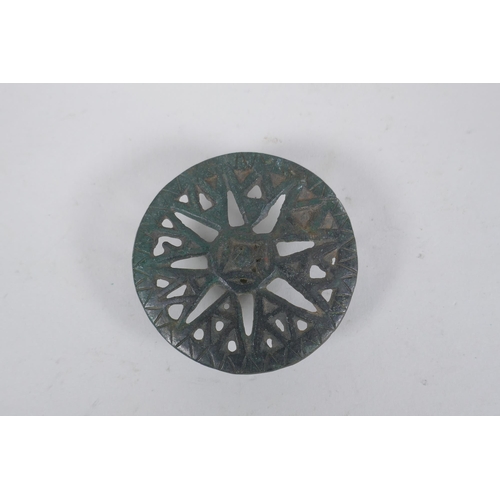 270 - Three early bronze armour mounts, 7cm diameter