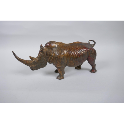 271 - A gilt bronzed metal rhinoceros, 24cm long