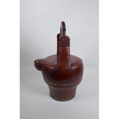 273 - An antique Chinese red lacquered wood basket with spout and carved handle, 40cm high