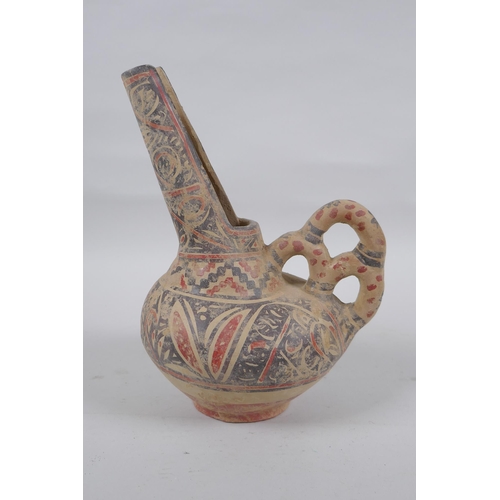 278 - An Islamic terracotta wine jug with painted decoration, 22cm high