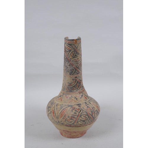 278 - An Islamic terracotta wine jug with painted decoration, 22cm high