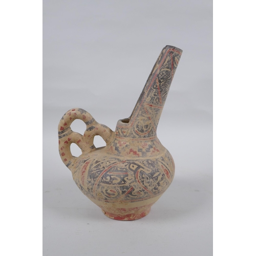 278 - An Islamic terracotta wine jug with painted decoration, 22cm high