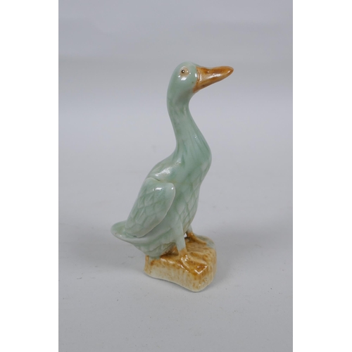 279 - An oriental celadon flambe glazed pottery water pot, and a Chinese celadon glazed duck, 11cm high