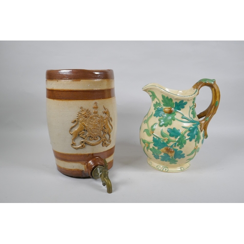 281 - A Mason's Ironstone hand painted pitcher with oak decoration, 24cm high, and an antique stoneware ke... 