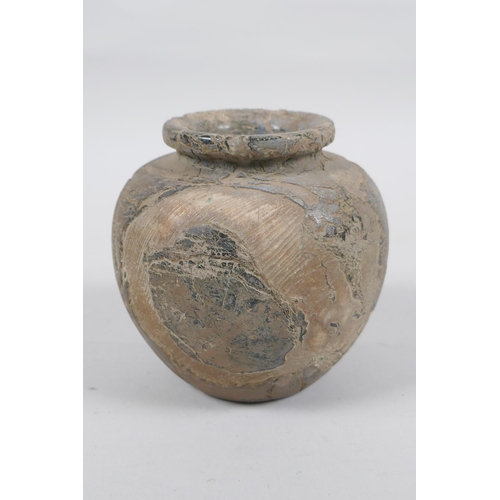 288 - An antique Eastern pot, 10cm high