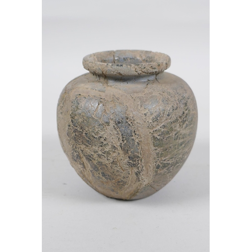 288 - An antique Eastern pot, 10cm high