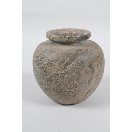 288 - An antique Eastern pot, 10cm high