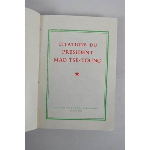 289 - A copy of Mao's little red book, a red enamelled metal plaque depicting Mao and a similar pin, 9 x 1... 