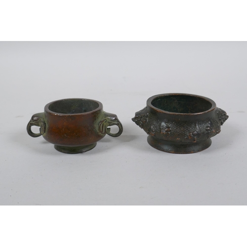 293 - A miniature Chinese bronze censer with two elephant mask handles, and another with lion mask handles... 