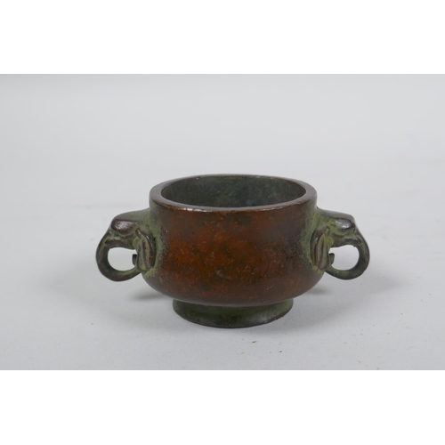 293 - A miniature Chinese bronze censer with two elephant mask handles, and another with lion mask handles... 