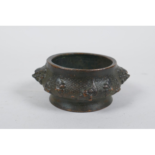 293 - A miniature Chinese bronze censer with two elephant mask handles, and another with lion mask handles... 