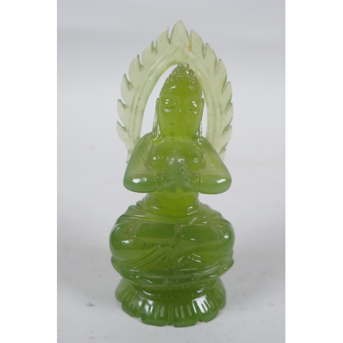 296 - An oriental carved green jade Buddha, 10cm high