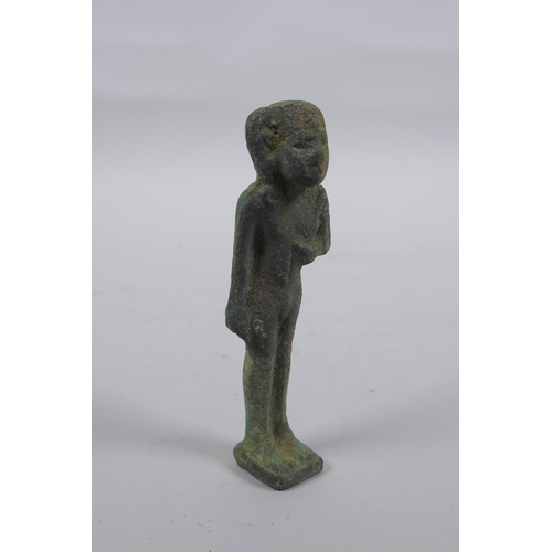 297 - An Egyptian bronze figure, 11cm high