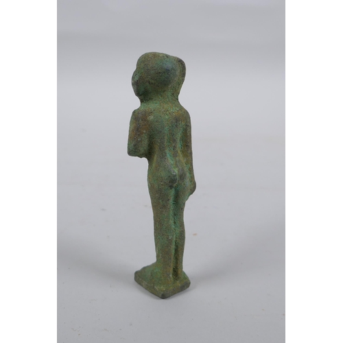 297 - An Egyptian bronze figure, 11cm high