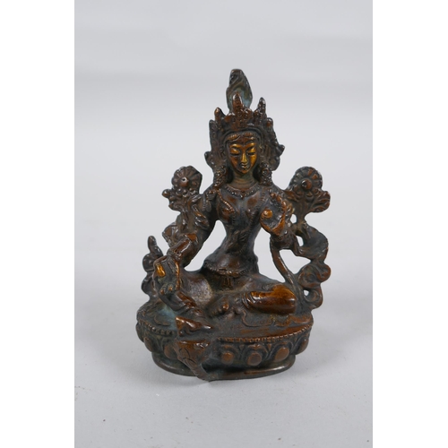 302 - A Tibetan bronze of Green Tara, 9cm high