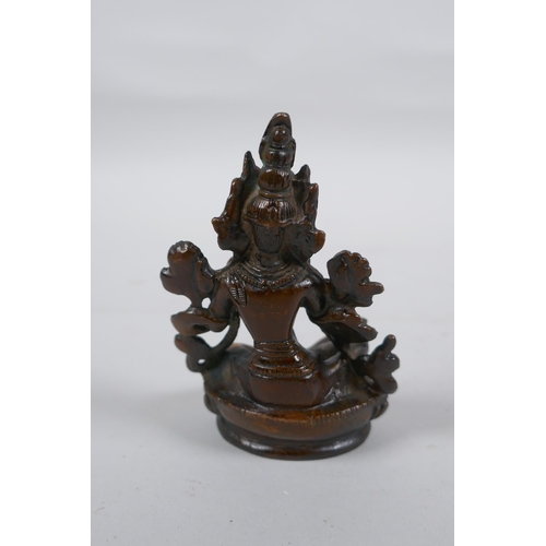 302 - A Tibetan bronze of Green Tara, 9cm high