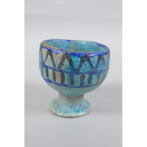 307 - A faience glazed stoneware goblet, 9cm high