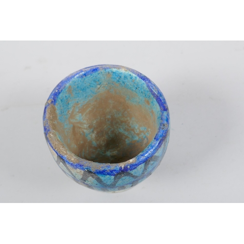 307 - A faience glazed stoneware goblet, 9cm high