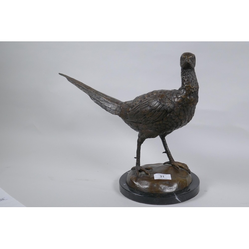 31 - A bronze figure of a pheasant, mounted on a marble base, unsigned, 33cm high