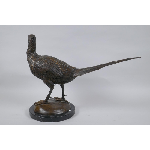 31 - A bronze figure of a pheasant, mounted on a marble base, unsigned, 33cm high