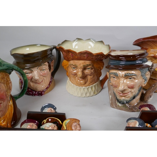 314 - A set of six Royal Doulton mask jugs and twelve miniature jugs with display shelves