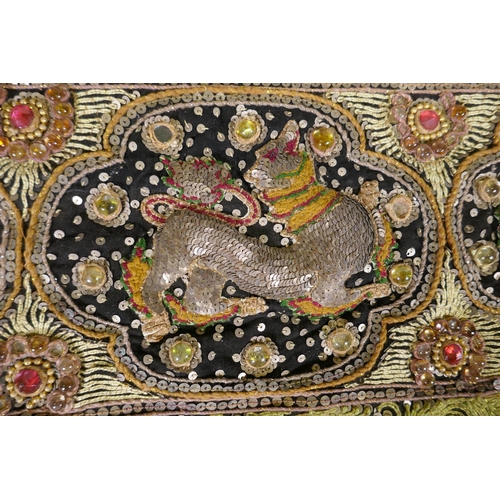 32 - An antique Burmese stump work wall hanging depicting dancers and tigers, 172 x 120cm