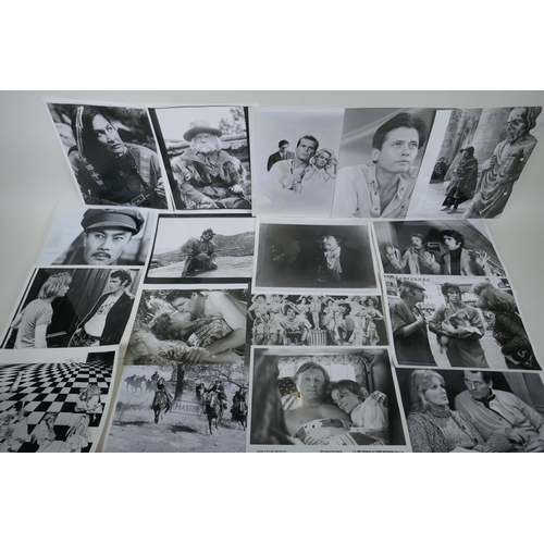 322 - A quantity of movie press photographs to include Donald Sutherland, Robert Shaw, Ursula Andres, Char... 