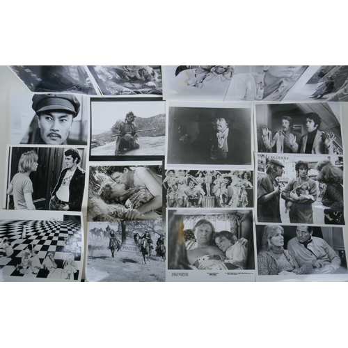 322 - A quantity of movie press photographs to include Donald Sutherland, Robert Shaw, Ursula Andres, Char... 