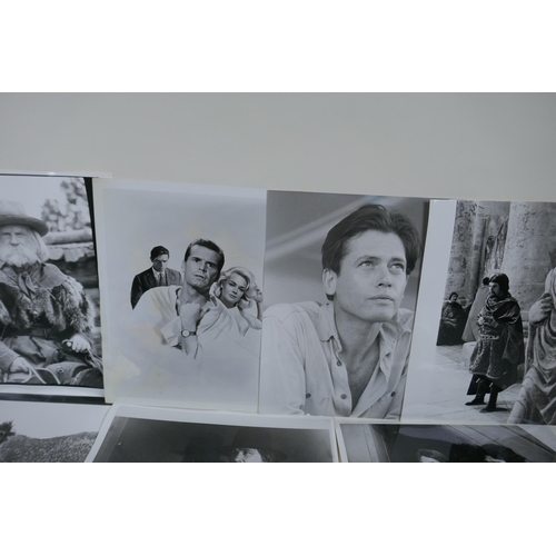 322 - A quantity of movie press photographs to include Donald Sutherland, Robert Shaw, Ursula Andres, Char... 