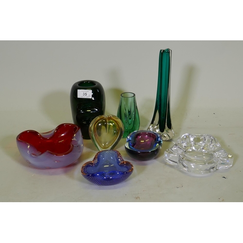 35 - A collection of Murano glass dishes, two spill vases, a green glass vase and an Orrefors dish, talle... 